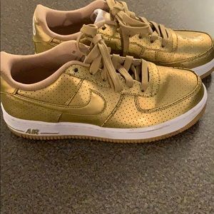 Gold Nike Air Force ones